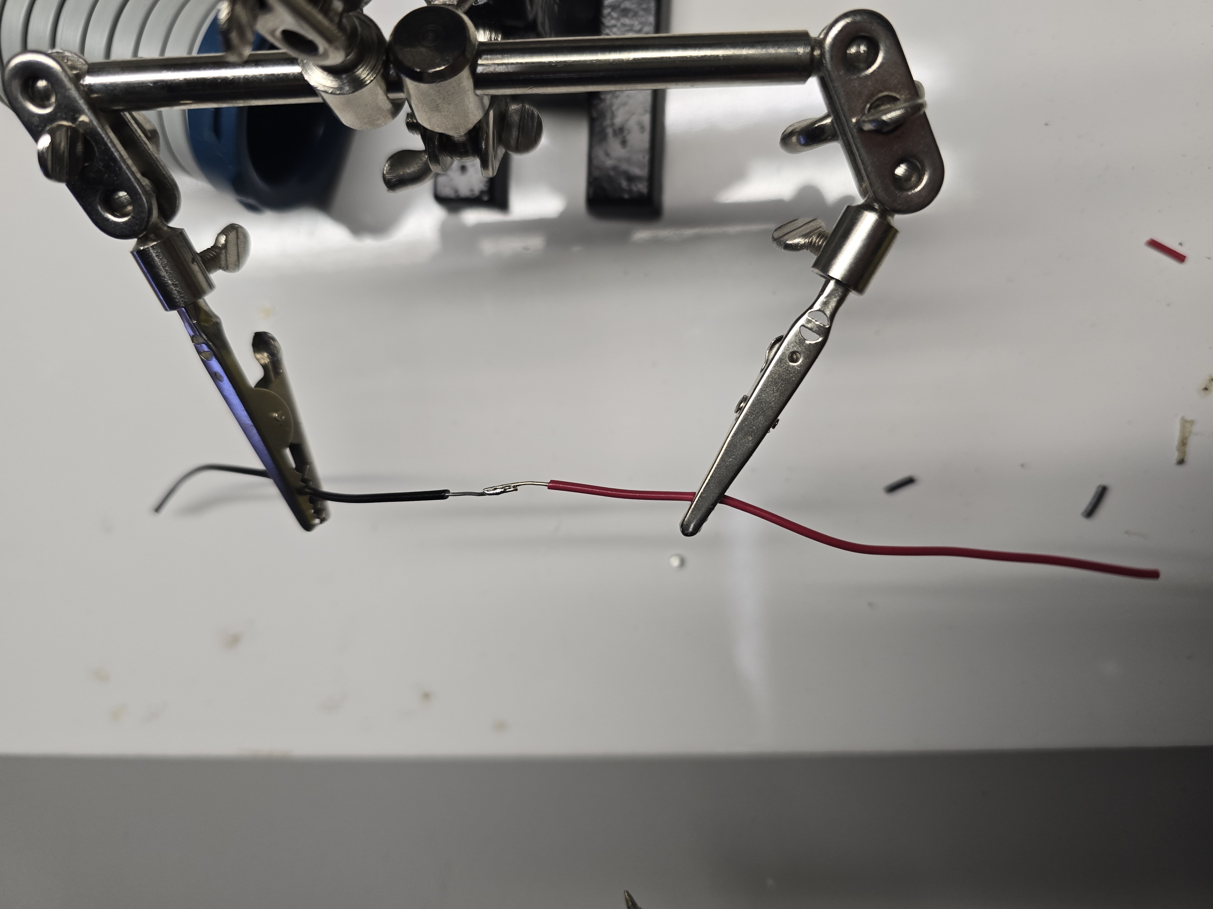 Close-up of solder joint between red and black wires