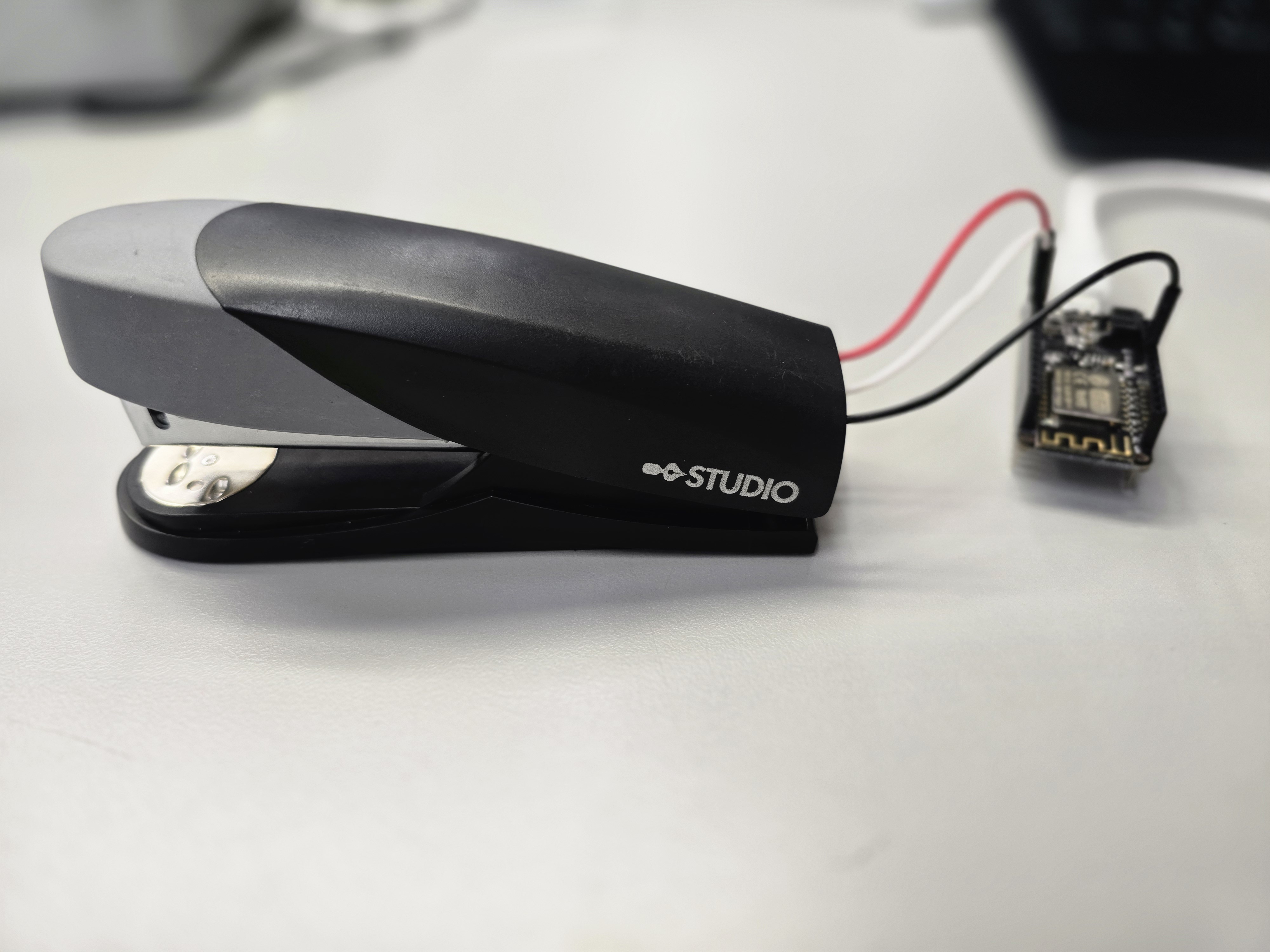 Closed stapler tethered to ESP8266 side view