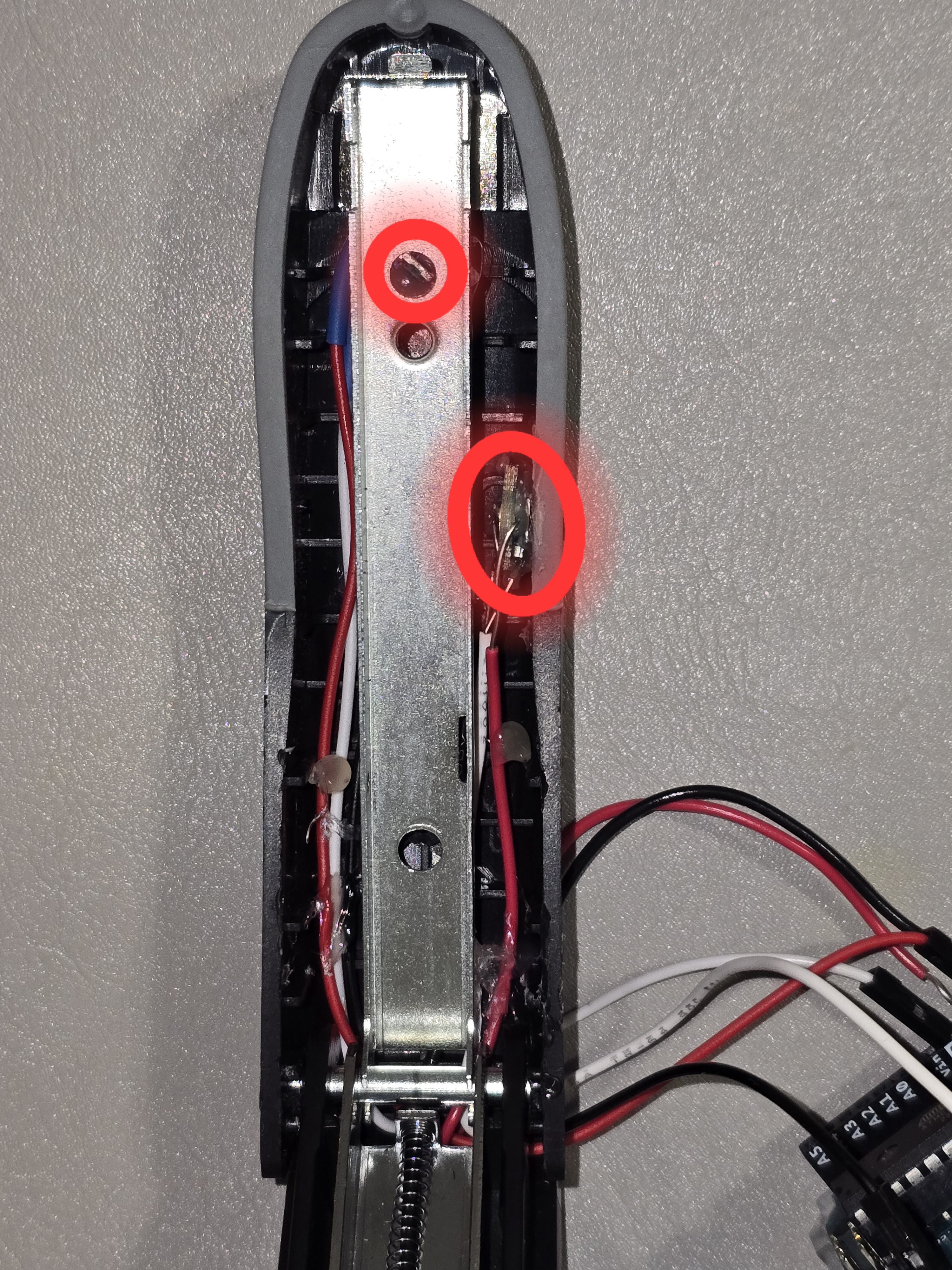 Highlighted Hall sensor and NeoPixel placement inside stapler